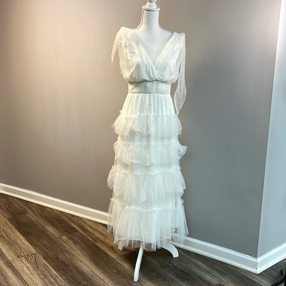 White dress beautiful pearl detail. Perfect for a bridal shower or wedding.